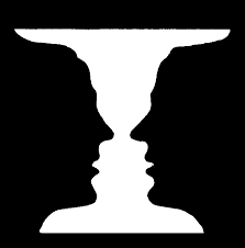 image explaining the figure ground relationship. it appears both as a vase or as two half faces, depends on how you see it.
