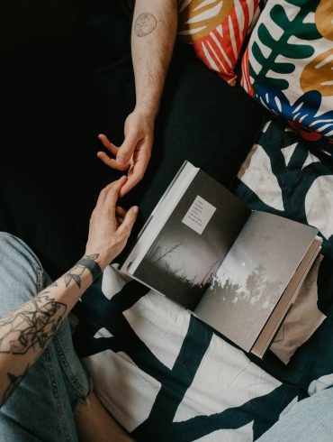 person holding black and white book