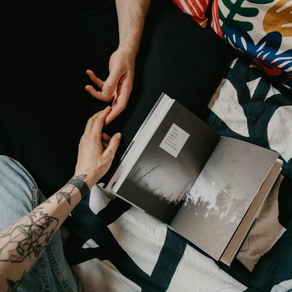 person holding black and white book