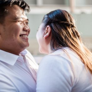 man in white polo shirt kissing woman in white shirt